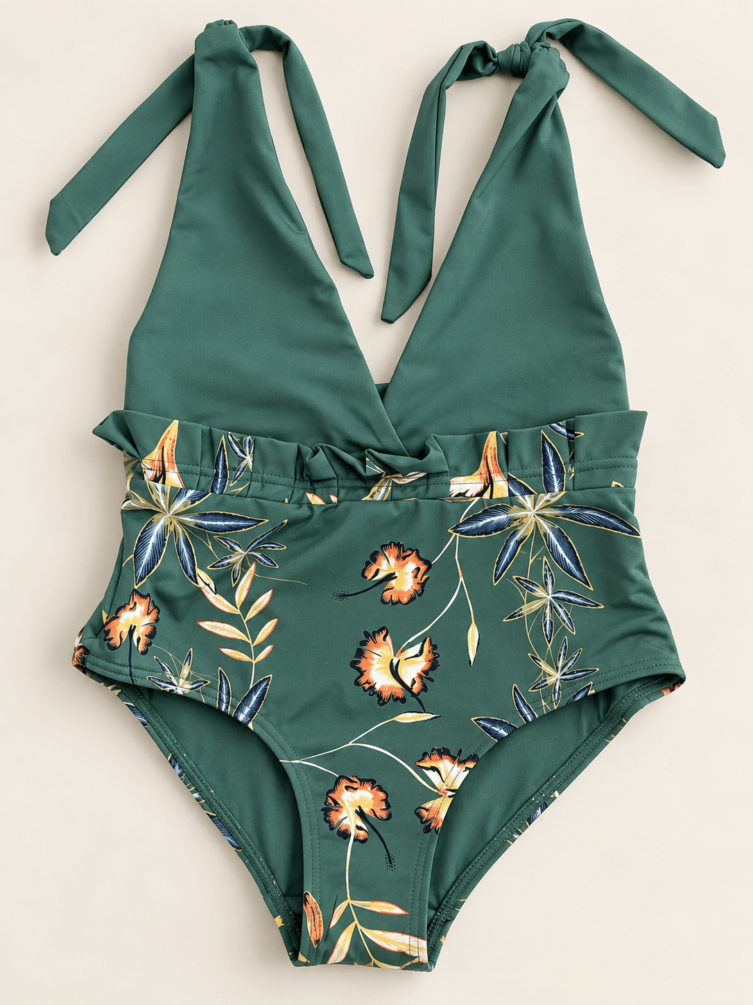 Fato de banho infantil verde escuro com laços e cós franzido, estampado tropical