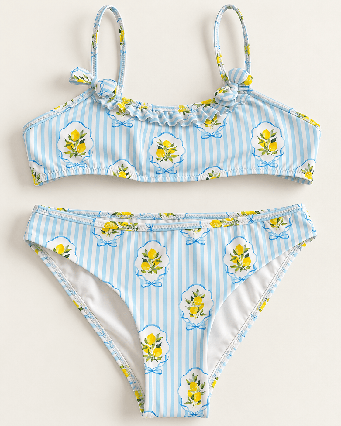 Biquíni infantil azul claro às riscas com flores amarelas e laços nas alças, top e cueca